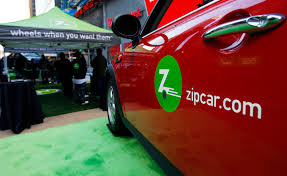 zoomed in image of side panel of zipcar logo on car